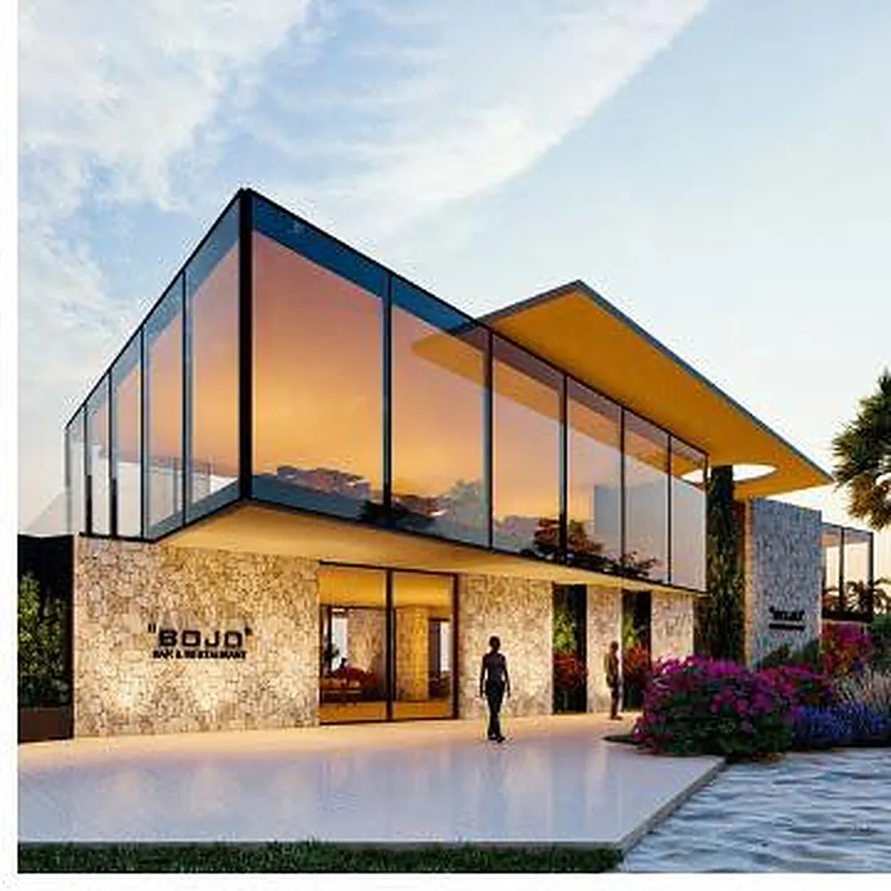 The glass-and-stone facade of BOJO Resort at golden hour, Albanian Riviera