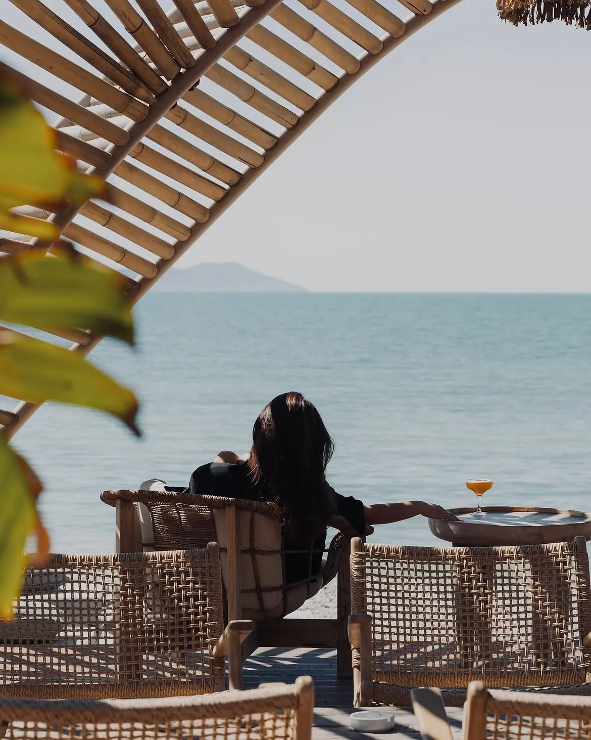 A guest relaxing with sea views at BOJO Resort beach club
