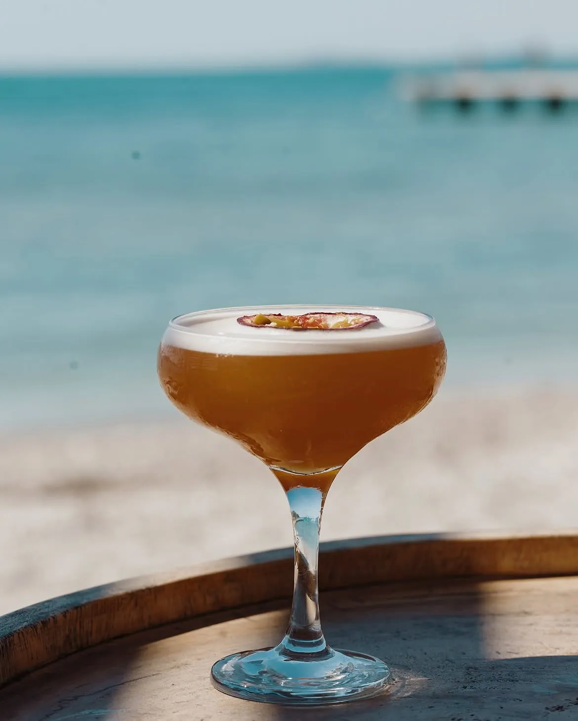 Signature cocktail at golden hour at the BOJO Resort bar