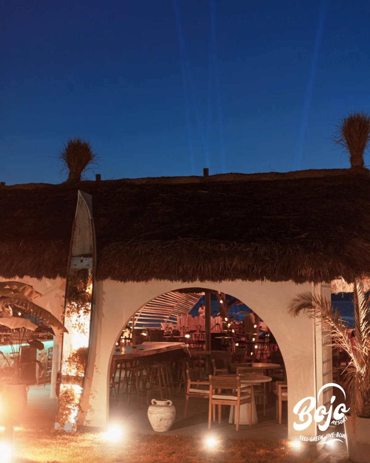 The warm-lit terrace at BOJO Resort in the evening, Orikum
