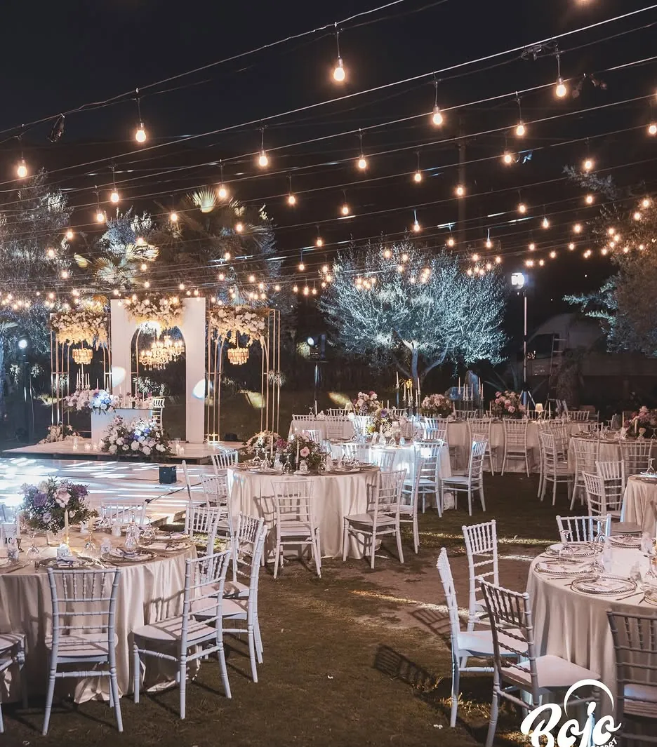 Evening private event under string lights at BOJO Resort