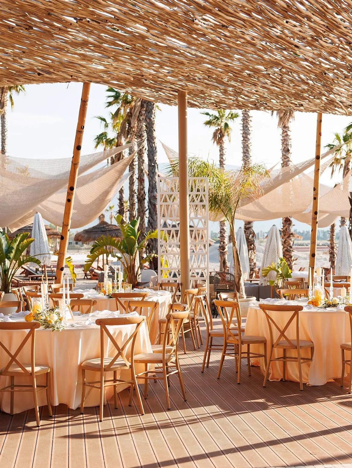 Private event and group dinner setup by the sea at BOJO Resort