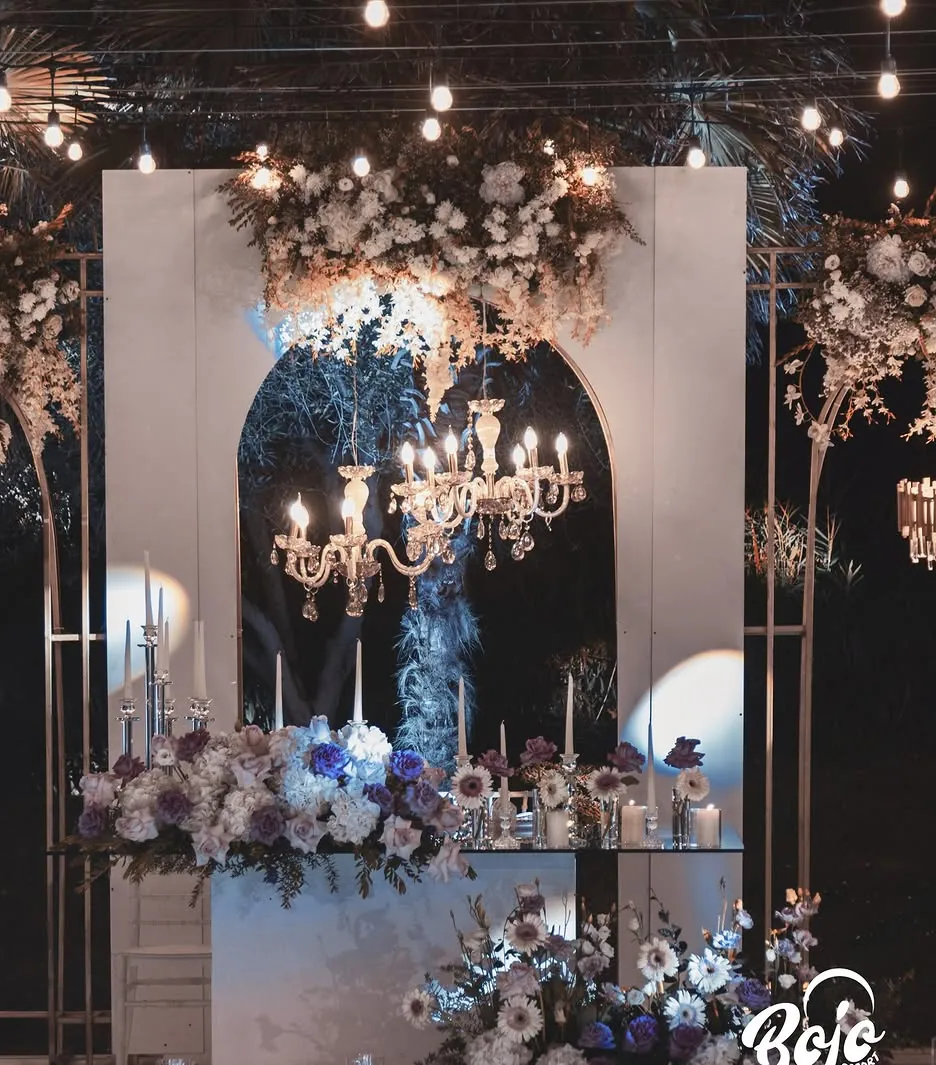 Elegant wedding reception with chandeliers at night at BOJO Resort