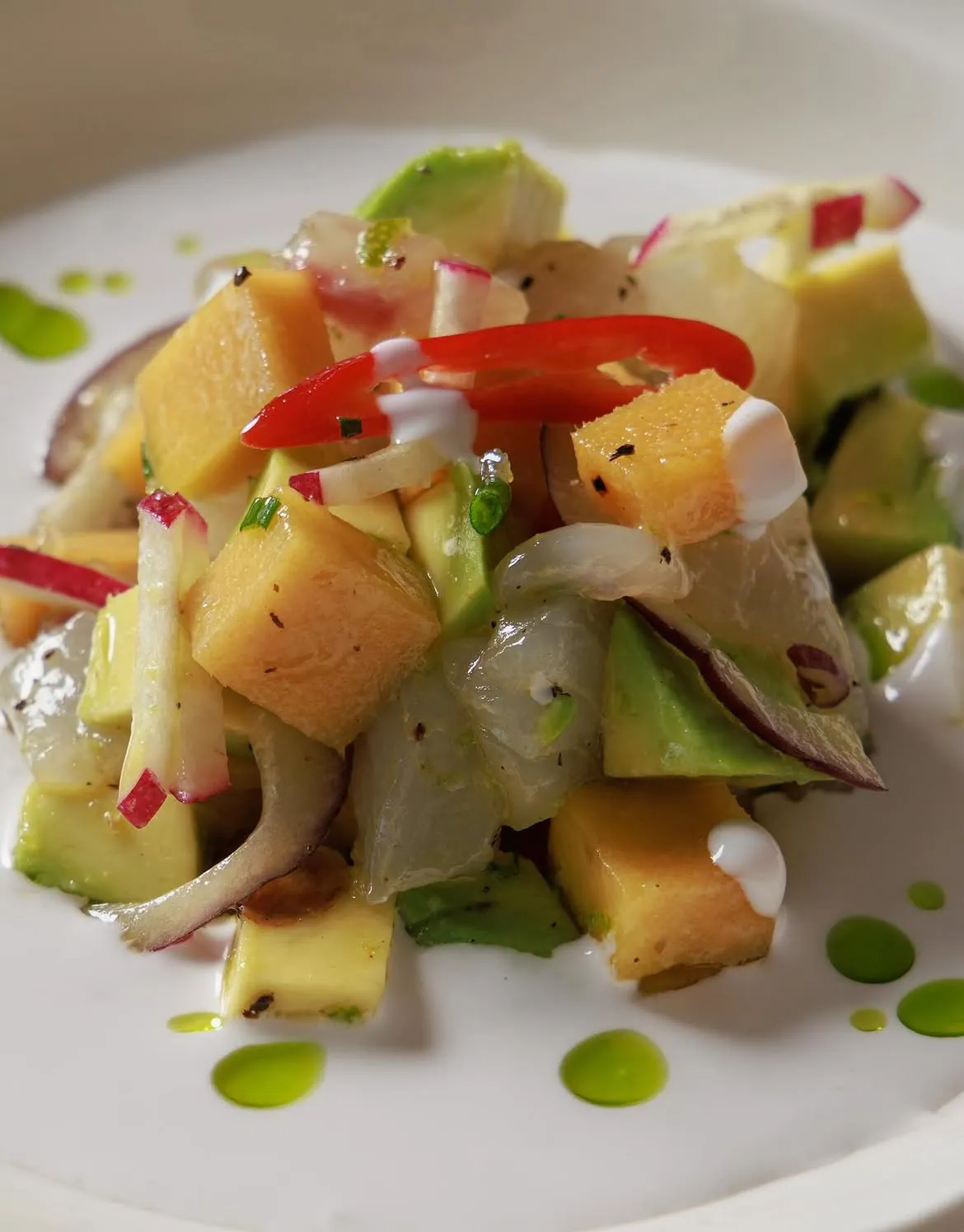 Citrus seafood salad plated at BOJO Resort seaside restaurant