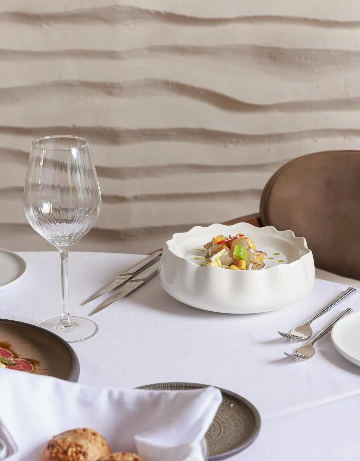 Refined plated seafood dish at BOJO Resort restaurant on the Vlorë coastline