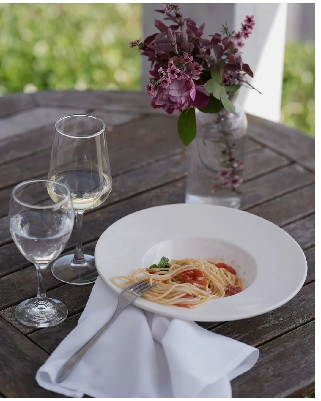 Fresh pasta and wine on a seaside table at BOJO Resort, Orikum